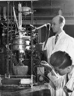 Reuben E. Wood and Richard Wallis working in a George Washington University chemistry laboratory.