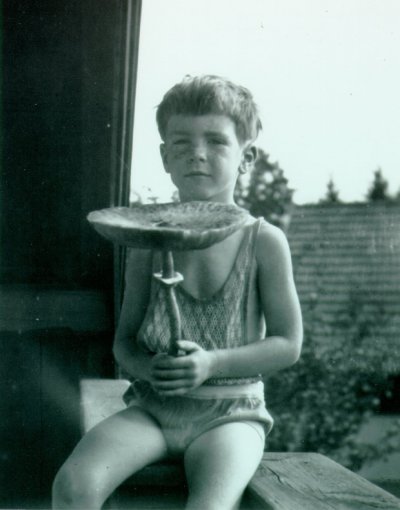 Linus Pauling, Jr. holding a large mushroom, Munich, Germany. Picture. 1930