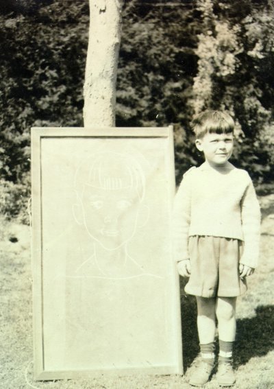 Peter Pauling standing next to a chalk portrait of himself. Picture. 1935