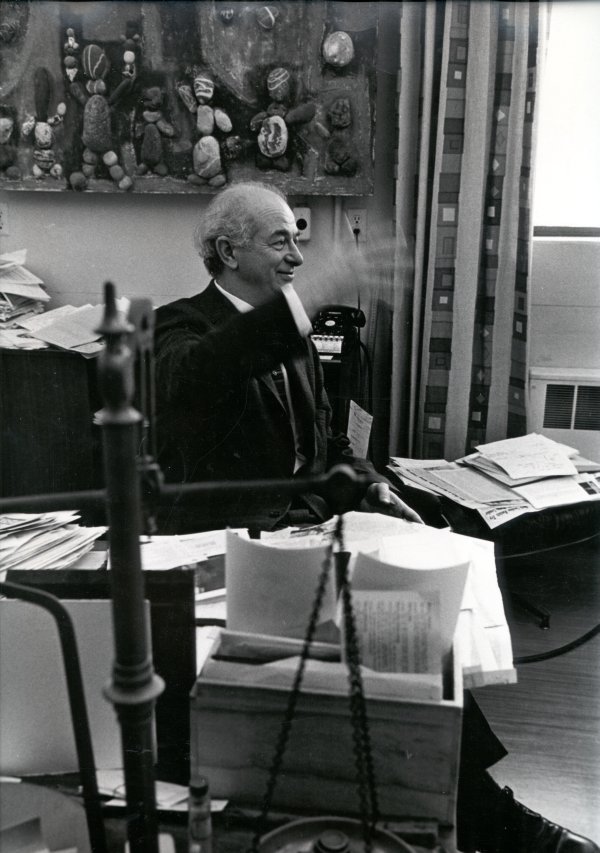 Linus Pauling gesturing in his Caltech office.