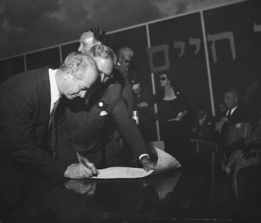 Linus Pauling signing the cornerstone scroll at the dedication ceremony for the Isaac Wolfson Building and the cornerstone laying for the Institute of Physics at the Weizmann Institute of Science. Rehovot, Israel.