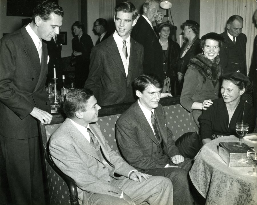 The Pauling children at a gathering in celebration of the 1954 Nobel Prizes. Stockholm, Sweden. Seated from left: Linus Pauling, Jr., Peter Pauling, Anita Oser Pauling and Linda Pauling. Standing from left:  An unidentified individual and Crellin Pauling.