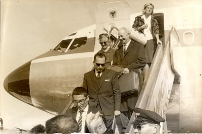 Linus Pauling and Ava Helen Pauling disembarking from an airplane. Buenos Aires, Argentina. Picture. 1963