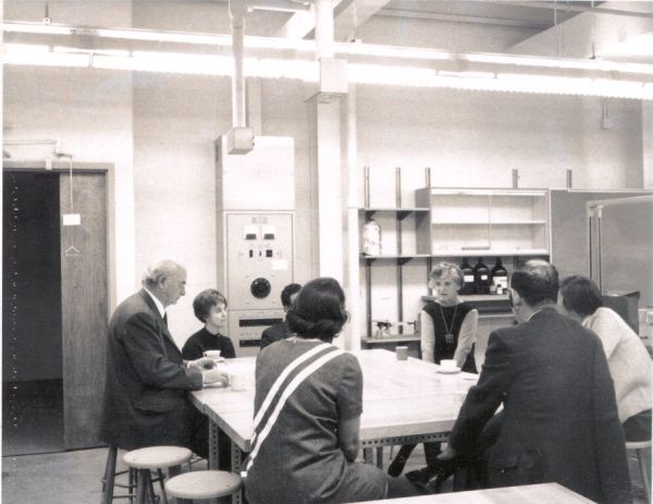 Linus and Ava Helen Pauling among a group drinking coffee in a Wilson College laboratory. Picture.