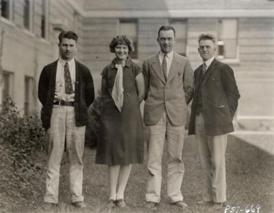 OSC Journalism staff with Portland correspondents. Pictured from left to right are Webley Edwards, Eunice Rydman, A. Lowell McMillian and John C. Burtner.