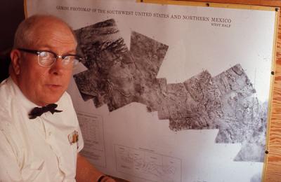 <p>Charles Poulton posing with a remote sensing chart, 1974. Poulton was a professor of Range Management, eventually becoming the Director <span class='highlight3 bold'>of</span> the Range Management program, <span class='highlight1 bold'>and</span> also the first director <span class='highlight3 bold'>of</span> the Environmental</p><p>				Remote Sensing Applications Laboratory.</p>