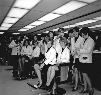 <p>Mortar Board members at a hair salon, ca. 1969. From left to right: Jeanne Fukuji, Helen Pitney, Carol Burroughs, Bobbie Mikkelson, Sheryl Rosvall, Gretchen Heesacker, Carol Setniker, Cathy Beckley, Kristine Paulson, Terri</p><p>				Tower, Nancy Oldfield, Jan Patton, Kris Tonn, <span class='highlight2 bold'>and</span> Mary Bartle.</p>
