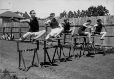 OAC sprinters running the high hurdles, 1905. From left to right: Belden, Graham, Swan, Smithson, Galhey.