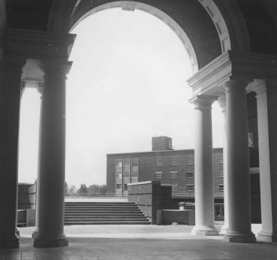 View of Poling Hall through Weatherford Hall arch.