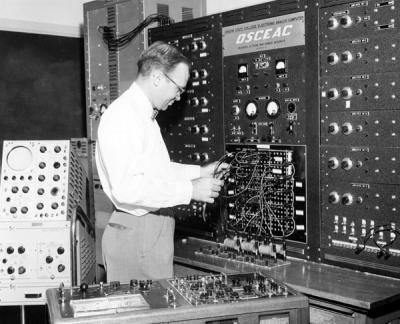 Harvey Christensen (Mechanical Engineering) working on the Oregon State College Electronic Analog Computer (OSCEAC), 1957.