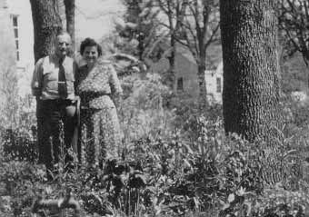 Louis and Lillian Gentner flanked by vigorous plants of  in their garden at 22 S. Groveland Avenue, Medford, Oregon, April 19, 1950.