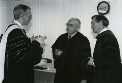 Dr. Dale Parnell (middle) speaking with Vincennes University president Phillip M. Summers and VU Vice President David Ford prior to VU's 185th commencement exercises, April 27, 1991.