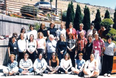 Sharon Rosenkoetter (middle row, right, in red and white checked shirt) with students involved in the Rural Links project, circa 2001.