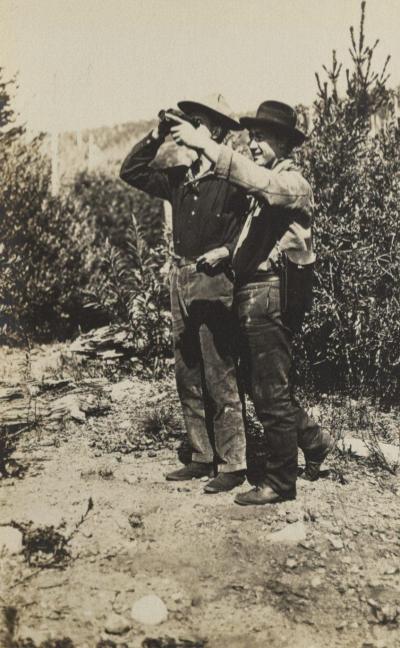 Men surveying the landscape near Mount Hood, Oregon, circa 1910.