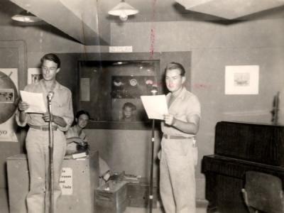 Broadcasting at an armed forces radio station, January 24, 1945. On the right is Captain Franklin K. Tourtellotte.
