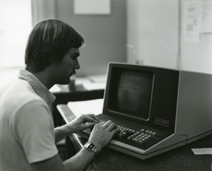 Using an early model desktop computer, ca. 1970s.