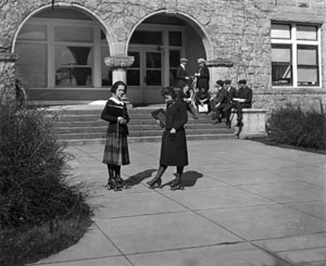Oregon Agricultural College co-eds rollerskating to class, early 1920s.