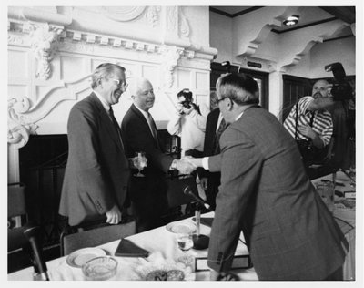 Black and white photograph of Paul G. Risser meeting John Vincent Byrne.