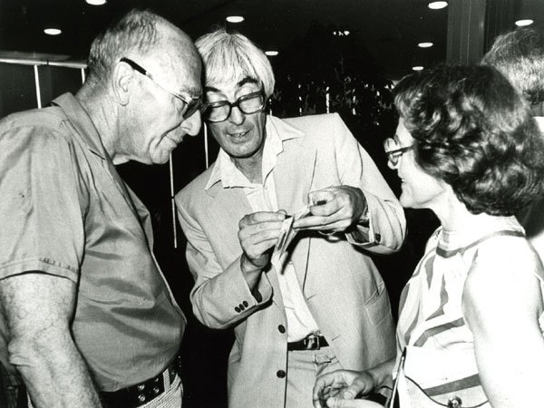 Jack Dunitz engaged in discussion with A. I. Kitaigorodskii and Olga Kennard, ca. 1970s.