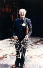 Linus Pauling holding molecular models of water based on the pentagonal dodecahedron, ca. 1960s.