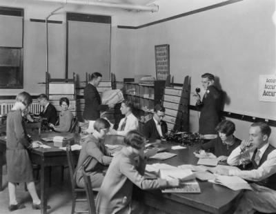 Barometer staff at the copy table, ca. 1930.
