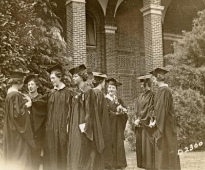 Coed graduates gathered outside the Women's Building, 1935.