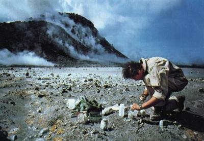 Dr. John Baross, a researcher at Oregon State University, taking samples to study from an area near the Mount St. Helens eruption site.