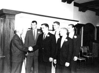 Blue Key initiation, ca. 1956. Dean Lemon shaking hands with Jim Long, John Narver, Bruce Roberts, Ivan Wood, and Cliff Kuhlman.