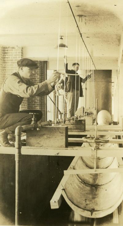 Image depicting a test for friction in pipes, ca 1920s.