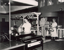 Campus cooks, 1950. This photograph depicts a typical day for the dedicated cooks who created the meals for hungry students. The kitchen was at Sackett Hall.