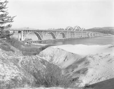 Image documenting the final stages of construction on the Alsea Bay Bridge, designed by Conde McCullough, ca. 1936.