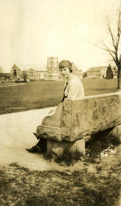 Ruby Stafrin Irwin seated on the east end of the OAC campus, ca 1920s.