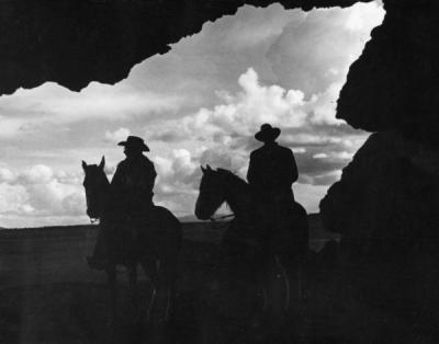 Cowboys at the entrance to Reub Long's cave, where sandals were found that were 10,000 years old, ca 1940s.