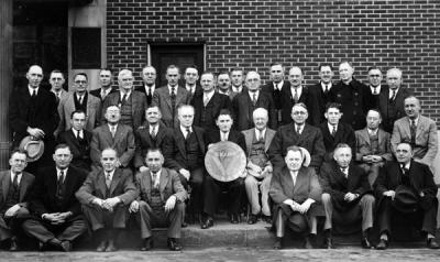 Triad Club in front of Hotel Corvallis, 1940. William E. Milne stands back row, third from right. Milne was the chair of the Mathematics Department from 1932 to 1955.