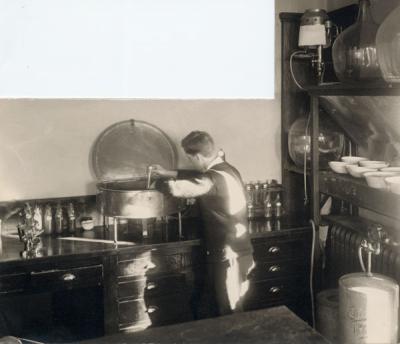 An unidentified individual conducting a mechanical analysis of soils in the Oregon Agricultural College Soil Physics Laboratory, ca 1920s.