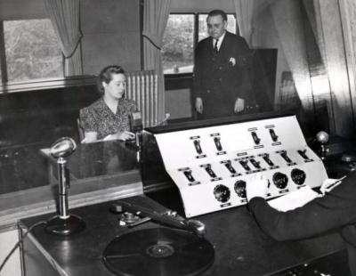 Shepard Hall speech studio; Dr. Mitchell stands at right. ca 1940s.