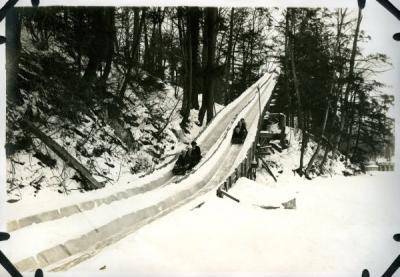 Unannotated image of a sledding outing, ca 1920s.