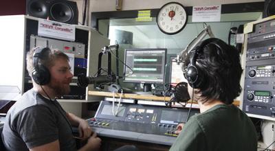 Joey Hulbert and Zhian Kamvar, broadcasting from the studios of KBVR-FM.