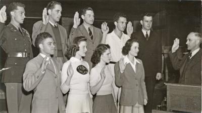Associated Students at OSC, May 1941. Dean Gilfillan, far right, administers a loyalty pledge to the student body officers of OAC. Front row from left is: Andy Landforce, President; Jeanette Sims, 2nd Vice President; Adele Knerr, President of Associated Women Students; Dorothy McArthur, secretary. Back row: Taylor Charles White, yell king; Bill Teutsch, 3rd Vice President; Ken Robinson, 1st Vice President; Joe Ross, Barometer editor; Douglas Carter, Memorial Union president.