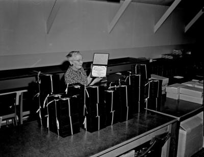 Eva Blackwell with diplomas, 1963. After graduating from Oregon Agricultural College in 1924, Blackwell worked in the Registrar's Office for more than 40 years until her retirement in 1965