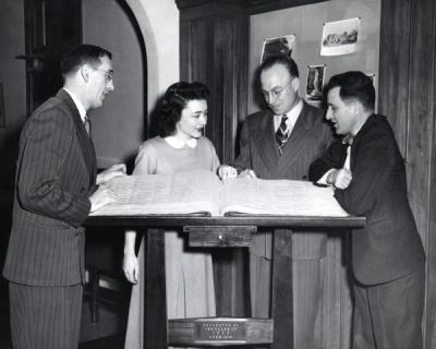 Left to right: Dan W. Poling, an unidentified woman, Ted Yerian and Fred Shideler.