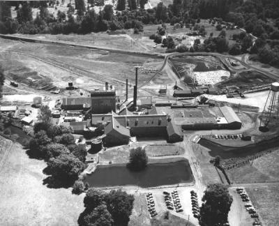 Aerial view of the Crown Zellerbach mill, log yards and holding ponds, 1949.