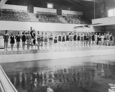 Swimmers at the Men's Gymnasium Pool, the first swimming pool built at the university, ca. 1920s.