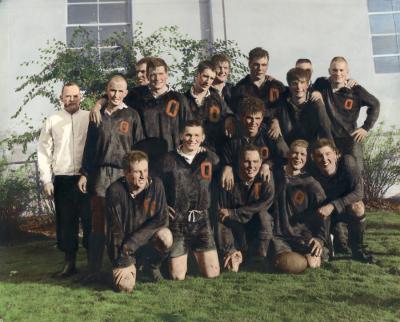 Hand-colored team portrait of the OSU Rugby Club, 1964-1965. Original print is annotated: "Wayne Valley, back row 3rd from right."