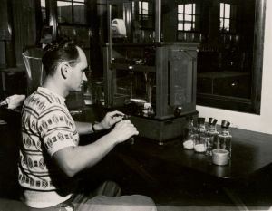 Robert Magee running a hops analysis sample, August 1950.