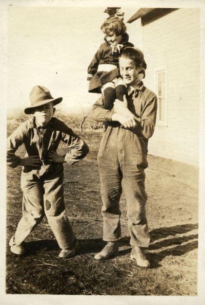 Owen, Helen and Chester Searcy on the family farm