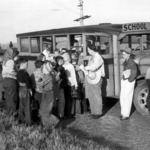 Youth boarding school bus to go to the fields