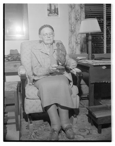 Grace French McCormick posing with a taxidermied owl_P082_02-2192.jpg