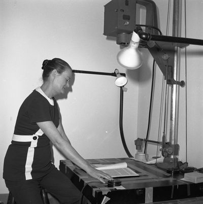Sally Wilson using a microfilm camera
