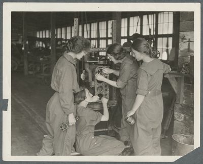 Female students in an auto mechanics class
